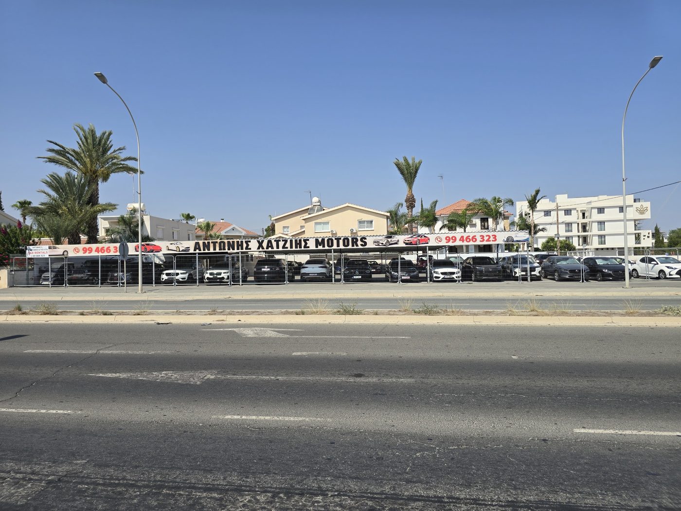 Xatzis Motors storefront with cars parked outside in Aradippou